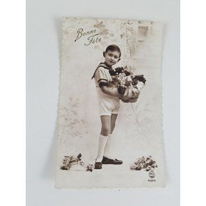 RPPC Young Dutch Boy in Sailor Shirt with a Basket of Flowers Vintage Bonne Fete